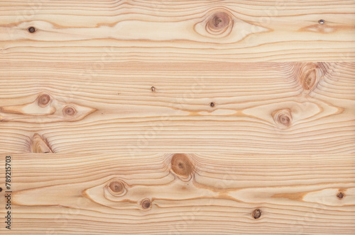 Surface of a natural untreated rustic style larch veneer texture background wallpaper without varnish, glaze or oil with knotholes