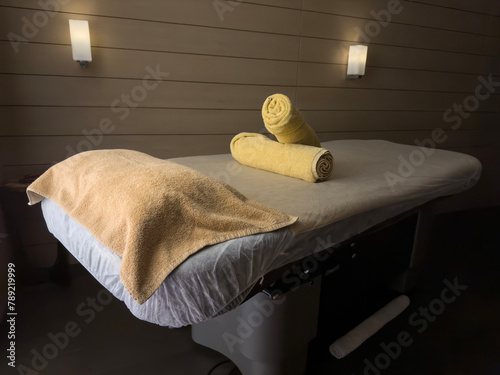 Towels on massage table in spa salon
