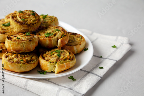 Homemade Chicken Pesto Pinwheels on a Plate, low angle view. Close-up.