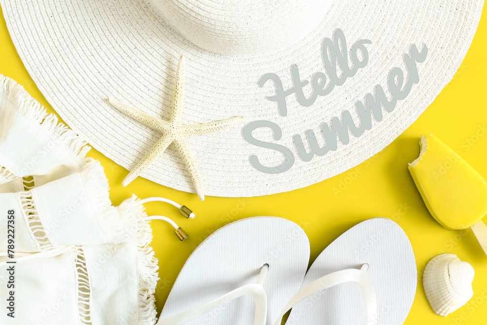 Hello summer text on sun hat, flip flops, ice cream and shells. Summertime, vacation, travel, tourism, seasonal concept. Yellow and white colors. Top view. - obrazy, fototapety, plakaty 
