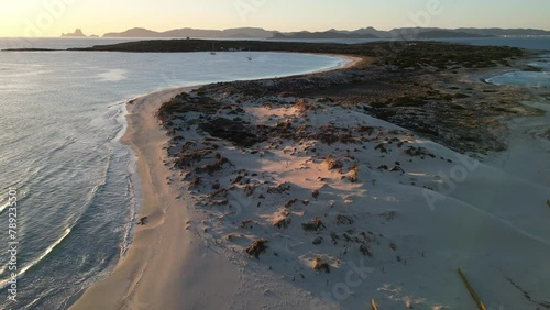 Espalmador beach, Formentera, at sunset. Ibiza and Es Vedra in the background. photo