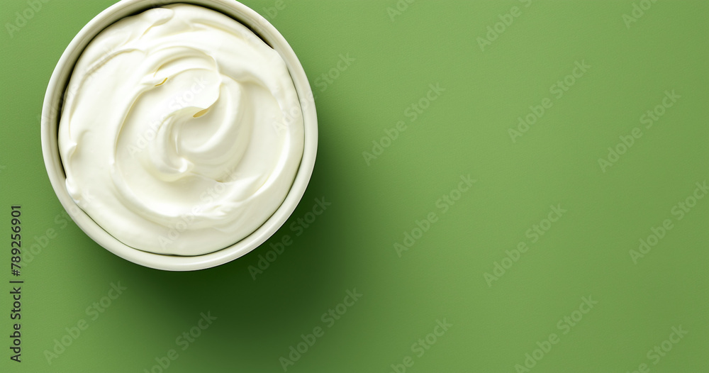 Top view of bowl with white quark or cream on side of green background with copy space сreated with Generative Ai Top view of bowl with white quark or cream on side of green background with copy space сreated with Generative Ai