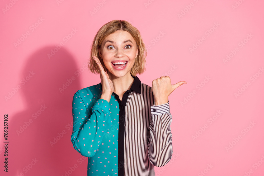Photo of pretty girl crossed hands confident excited point empty space wear trendy striped cyan outfit isolated on pink color background Photo of pretty girl crossed hands confident excited point empty space wear trendy striped cyan outfit isolated on pink color background
