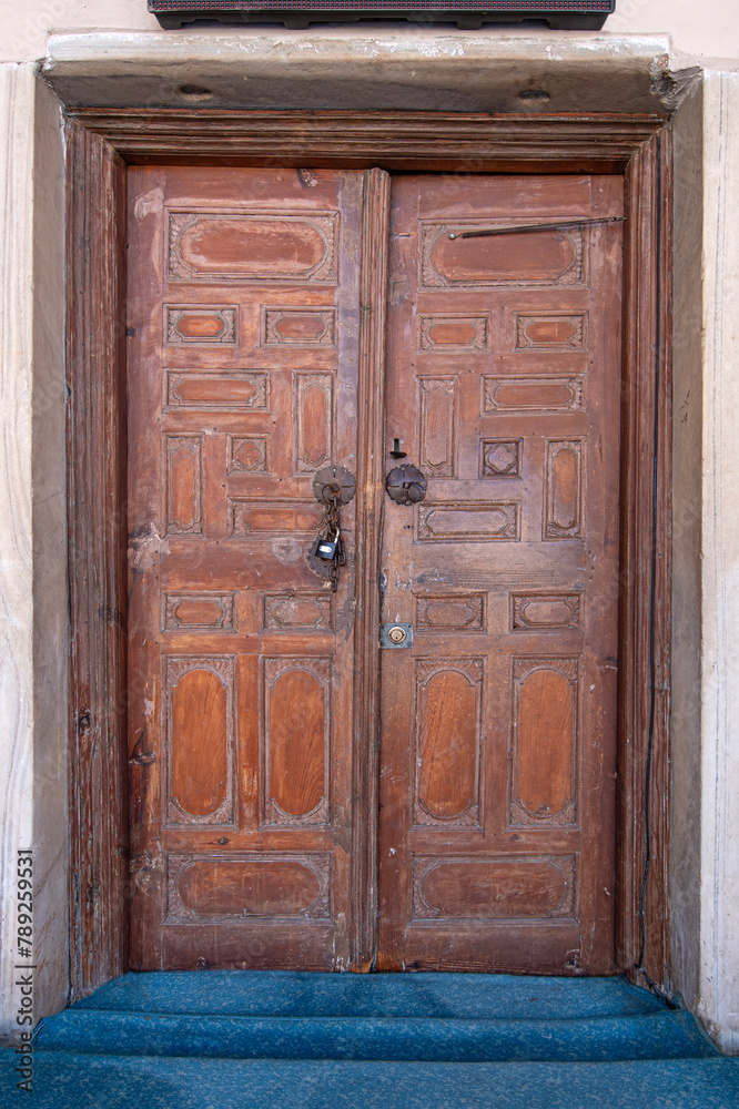 Traditional Ottoman Houses and historical inn doors in Manisa. Kula is on the UNESCO World Heritage List. Old wooden mansions Turkish architecture. Kula historical wooden and metal doors.