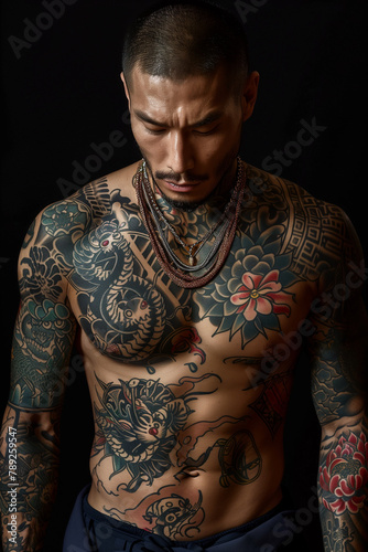 Handsome, young Yakuza member, his exquisitely tattooed body a masterpiece of artistry photo