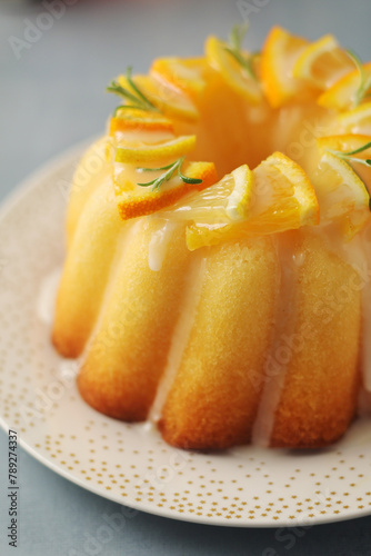 A sweet citrus cake served with oranges and lemons