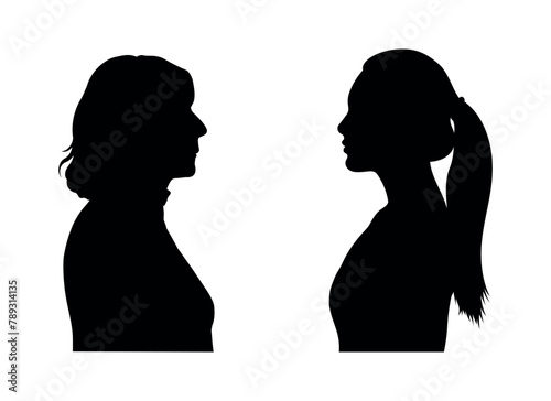 Middle aged woman and young woman facing each others side profile silhouette.