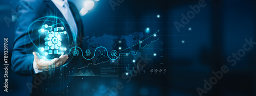 Businessman hand-holding machine learning icons with seamless network connections. Accelerating the growth of the tech industry and fostering innovation in businesses.