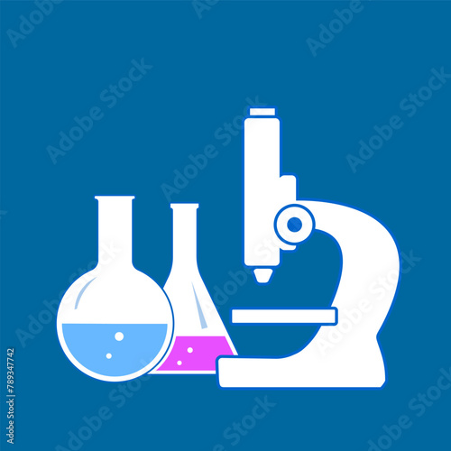 microscope and flasks with chemical reagents