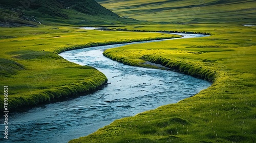 A minimalist shot of a winding river flowing through lush meadows, evoking a sense of peace and harmony.