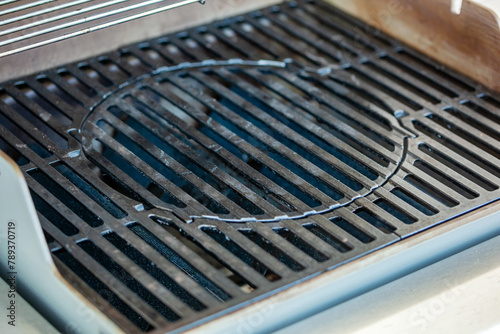 Cast iron barbecue grill to clean.