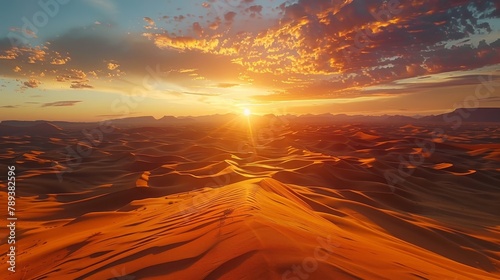 A desert landscape with a sun setting in the background. The sky is filled with clouds, and the sun is shining brightly. The scene is peaceful and serene