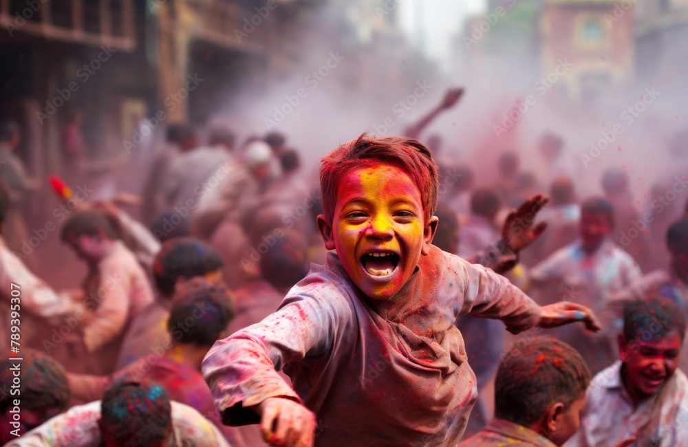 A boy is dancing in a colorful crowd