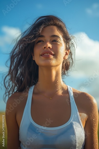 Joyful young woman with a radiant smile enjoys a sunny day  exuding happiness and vitality