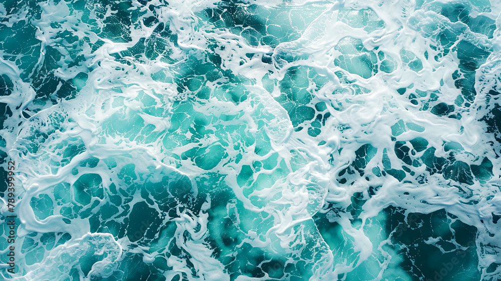 Naklejka premium This portrayal showcases of a lively turquoise sea with foam creating abstract and swirling patterns on the water. in a stunning visual representation.