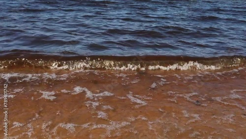 Waves on the beach of Papineau Lake in Ontario, Canada. photo