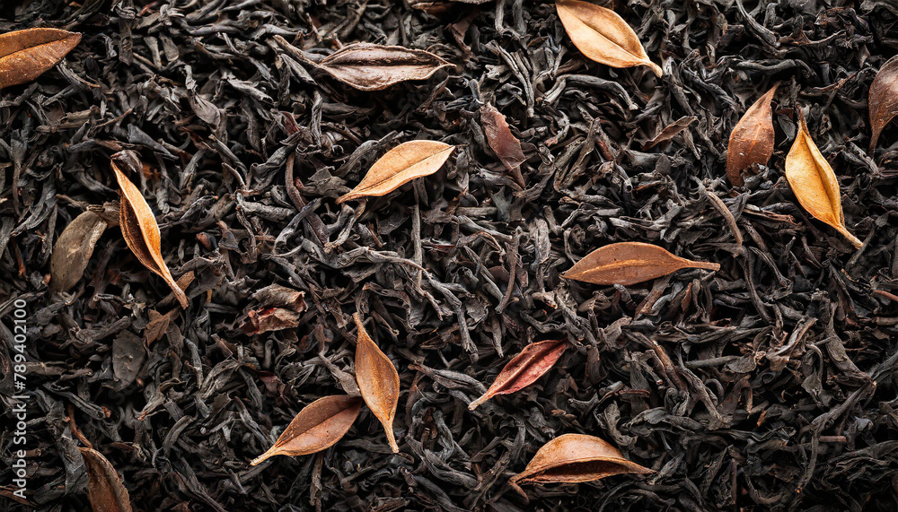 dry black tea leaves, offering a rich background texture dry black tea leaves, offering a rich background texture