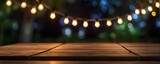Hanging lights on a wooden table with a green background