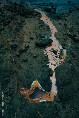 Oily water of an unknown origin bubbles from the mud of the Mississippi River south of Helena, Mississippi