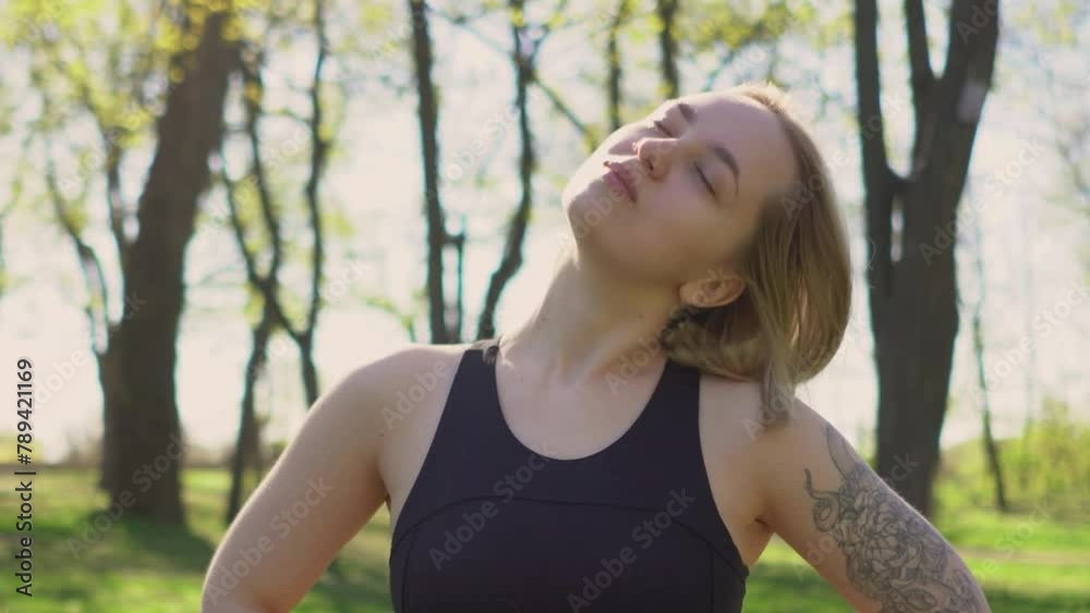 beautiful young athletic girl in leggings with a model figure on a morning jog in a green sunny park on the street. Fitness, warm-up and outdoor sports. beauty and health beautiful young athletic girl in leggings with a model figure on a morning jog in a green sunny park on the street. Fitness, warm-up and outdoor sports. beauty and health