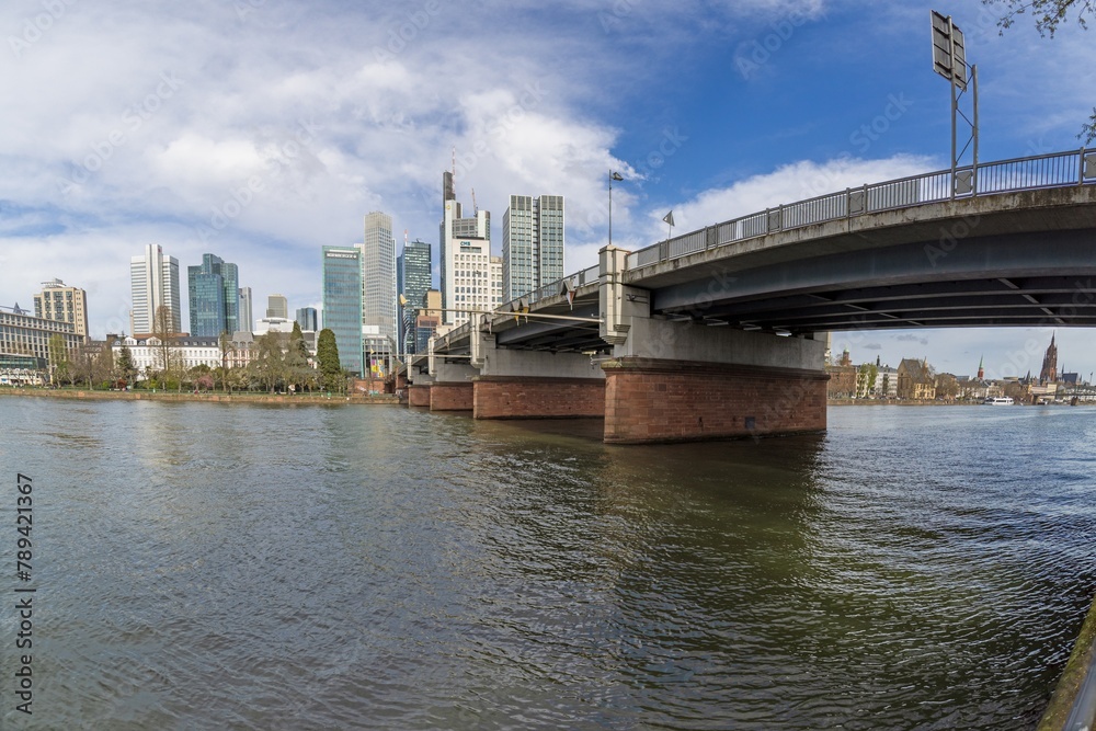 Panoramic picture of the Frankfurt skyline with Main and Friedensbrücke