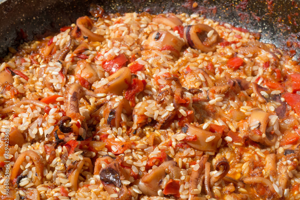 Rice Added to Paella Sofrito Culinary Infusion