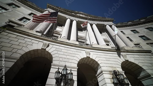 Wide angle view looking straight up at the flags and columns of the US Environmental Protection Agency, EPA building in Washington, DC. photo