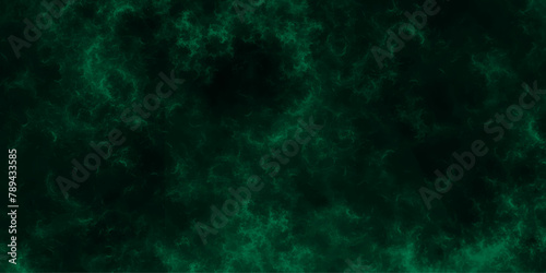 Green dust overlay particle abstract grunge texture on dark background. Abstract distressed vintage grunge. Jade color black particle explosion on dark background. Abstract design with fog on black.