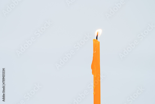 yellow candle flame  on white background