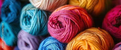 Various colorful yarn skeins and balls for knitting and crocheting craft projects on display in a photo book