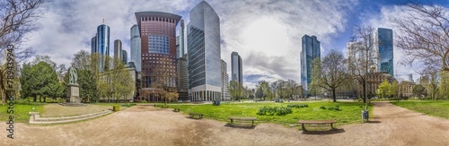 Panoramic picture of the Frankfurt skyline in front of blue sky with light clouds © Aquarius