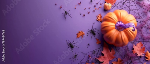 An overhead view of a Halloween pumpkin with leaves and spiders on a purple background. 3D rendering.