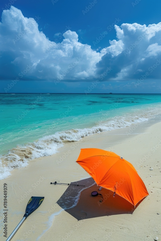 A vibrant orange umbrella on a sandy beach. Perfect for travel and vacation concepts