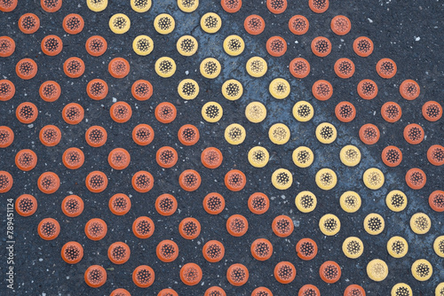 Abstract view of railway station platform with yellow and red tactile safety dots. Melbourne, Australia photo