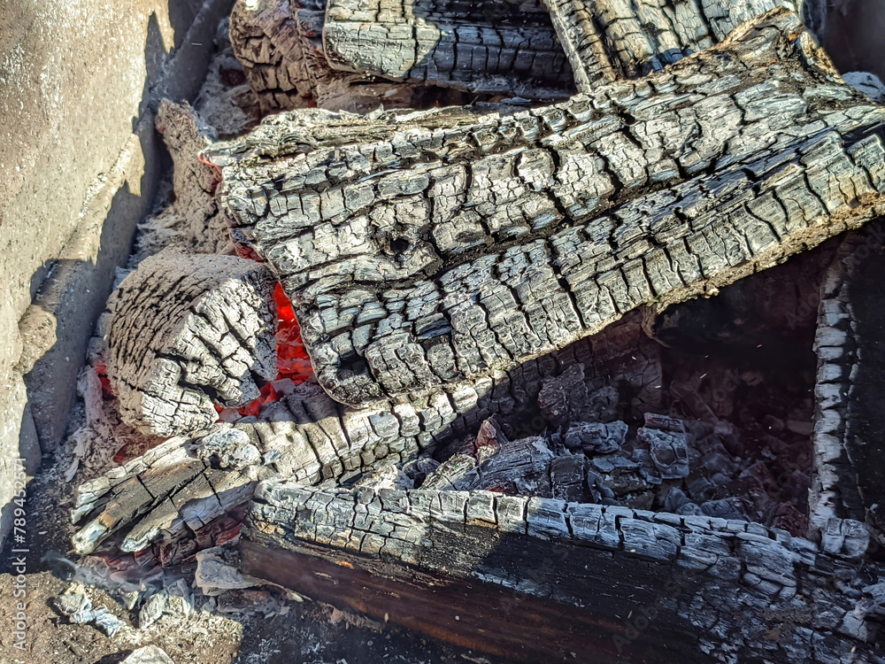 charcoal from burnt firewood in the barbecue