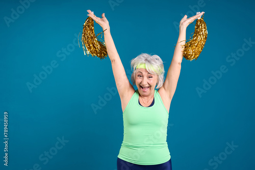 Excited Senior Celebrating with Cheer Accessories