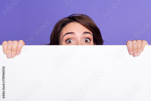 Schilderij op canvas Photo portrait of attractive young woman behind white empty space peek dressed s