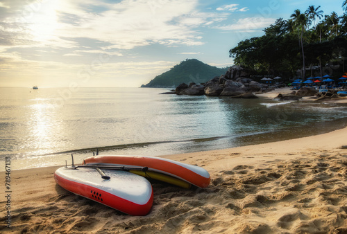 Empty seaside landscape sea sand beach with supboards on coast calm wave water surface photo