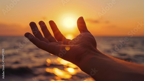 A person's hand reaching out to the sun as it sets, AI