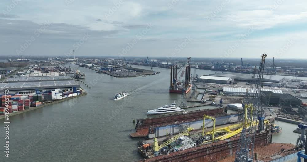 Aerial drone view of the Eemhaven in the port of Rotterdam, with short sea terminals in the background. Industrial port.