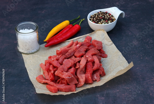 Raw shredded beef with spices. photo