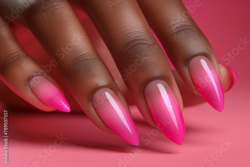 Delicate pink stiletto nails with a glossy finish  emanating feminine charm and subtle elegance