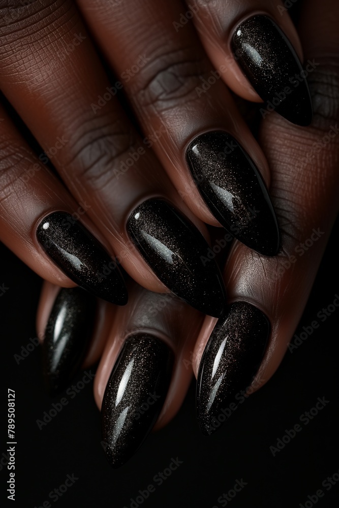 Elegant black stiletto nails with a subtle glitter, showcasing a sophisticated and bold manicure - obrazy, fototapety, plakaty 