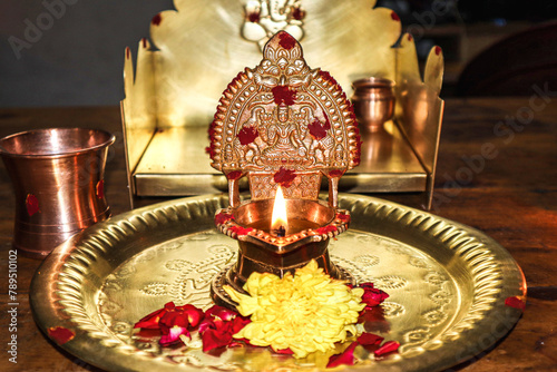 Tamil wedding stage. South Indian
traditional pooja lamb(kamatchi vilaku) with wooden background. photo