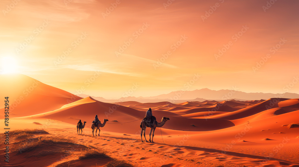 Tuareg with camels walk thru the desert on the western part of The Sahara Desert in Morocco. The Sahara Desert is the world's largest hot desert. Beautiful landscape, picture, phone screensaver, copy