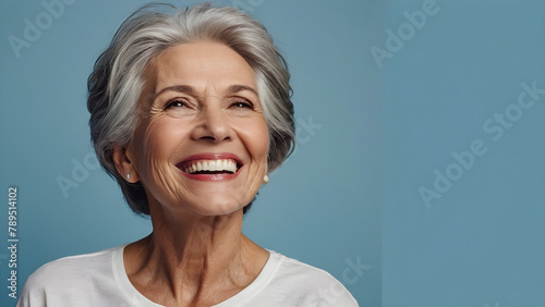 Dentistry concept. Snow-white smile of an elderly woman, close-up. Dental prosthetics concept