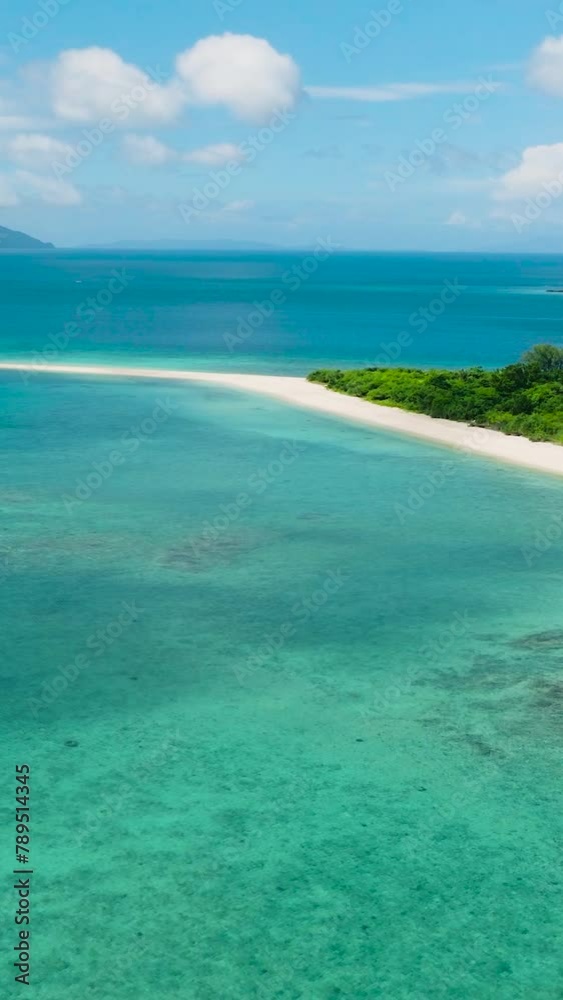 Aerial view of Bon Bon Beach with white sand and clear turquoise water. Romblon Island. Romblon, Philippines. Vertical view. Aerial view of Bon Bon Beach with white sand and clear turquoise water. Romblon Island. Romblon, Philippines. Vertical view.