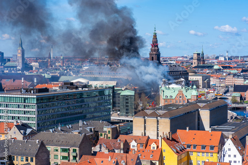 Black smoke drifts over central Copenhagen as historic Copenhagen Stock Exchange goes up in flames. Denmark
