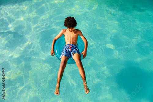 Teenage Boy Outgrows The Kid Sized Pool Floatie 