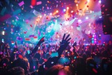energetic crowd cheering at live rock concert with colorful stage lights and falling confetti abstract background